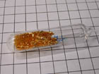 Gold crystals in the ampoule